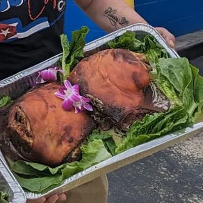Chef Joel&rsquo;s mojo roast pork, garnished with orchids