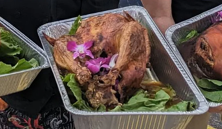 Chef Joel's golden Cuban-style baked turkey, garnished with orchids