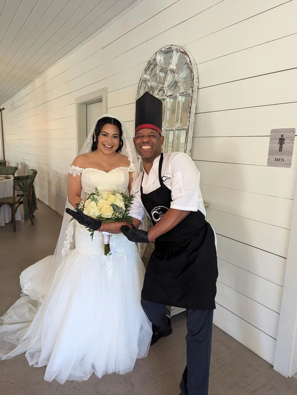 Chef Joel with a bride holding her bouquet