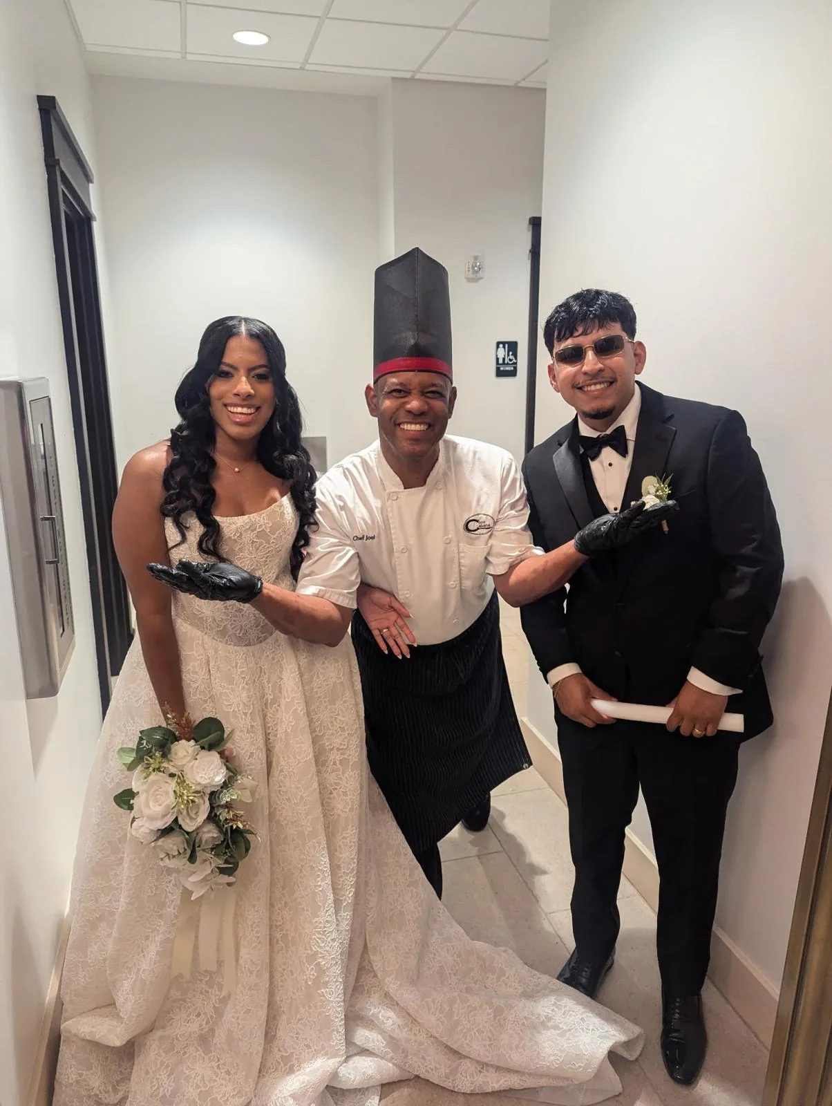 Chef Joel with a bride and groom at the venue